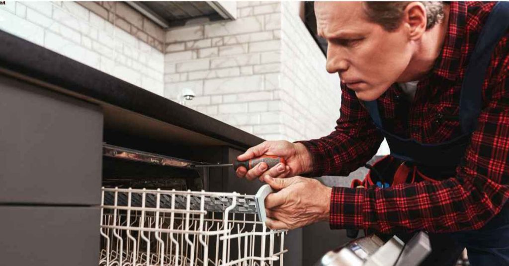homeowner trying to see why his dishwasher smells like wet dog