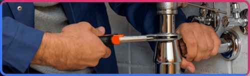 plumber in katy tx fixing a pipe