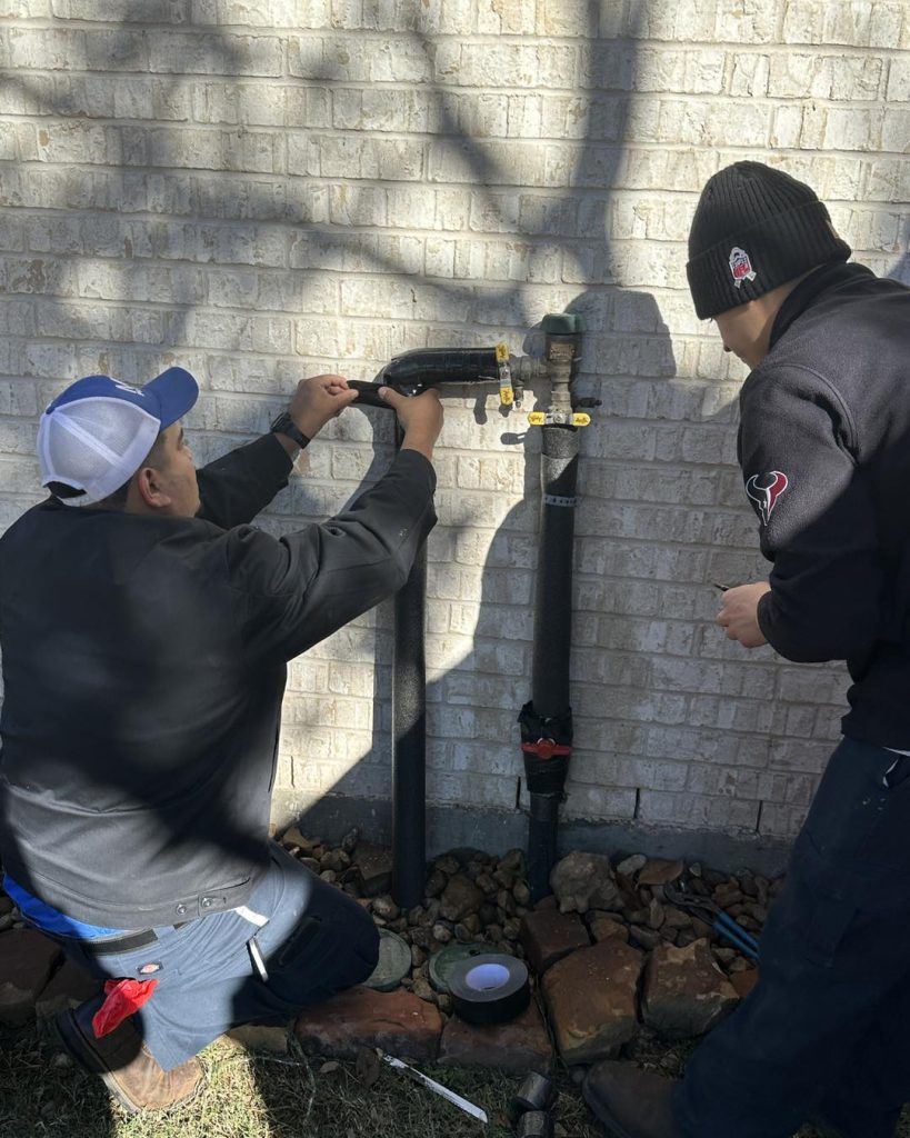 Sugar Land plumbers applying freeze protection to pipes